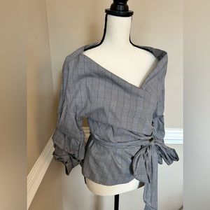Classic black and white pattern. Beautiful wrap top with adjustable neckline.